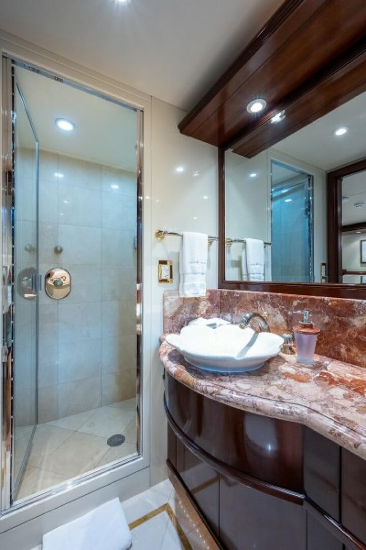 a bathroom with a glass shower aboard STARSHIP Yacht for Sale