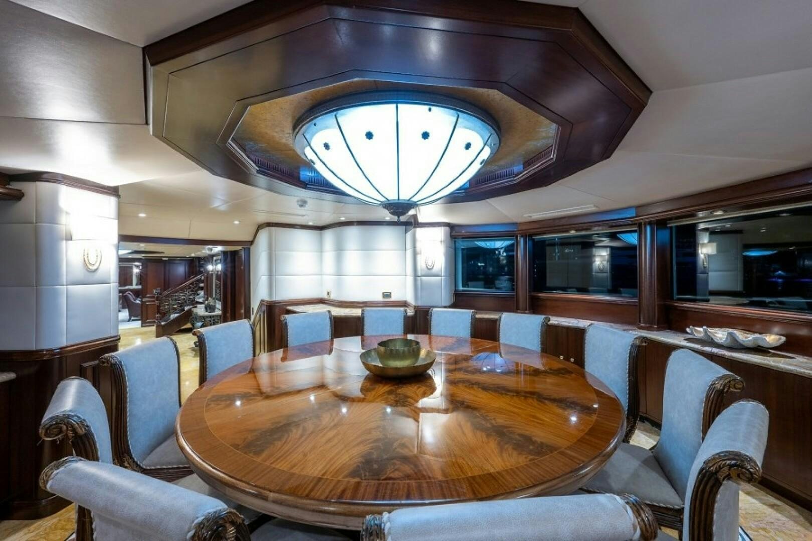 a large dining table in a room aboard STARSHIP Yacht for Sale