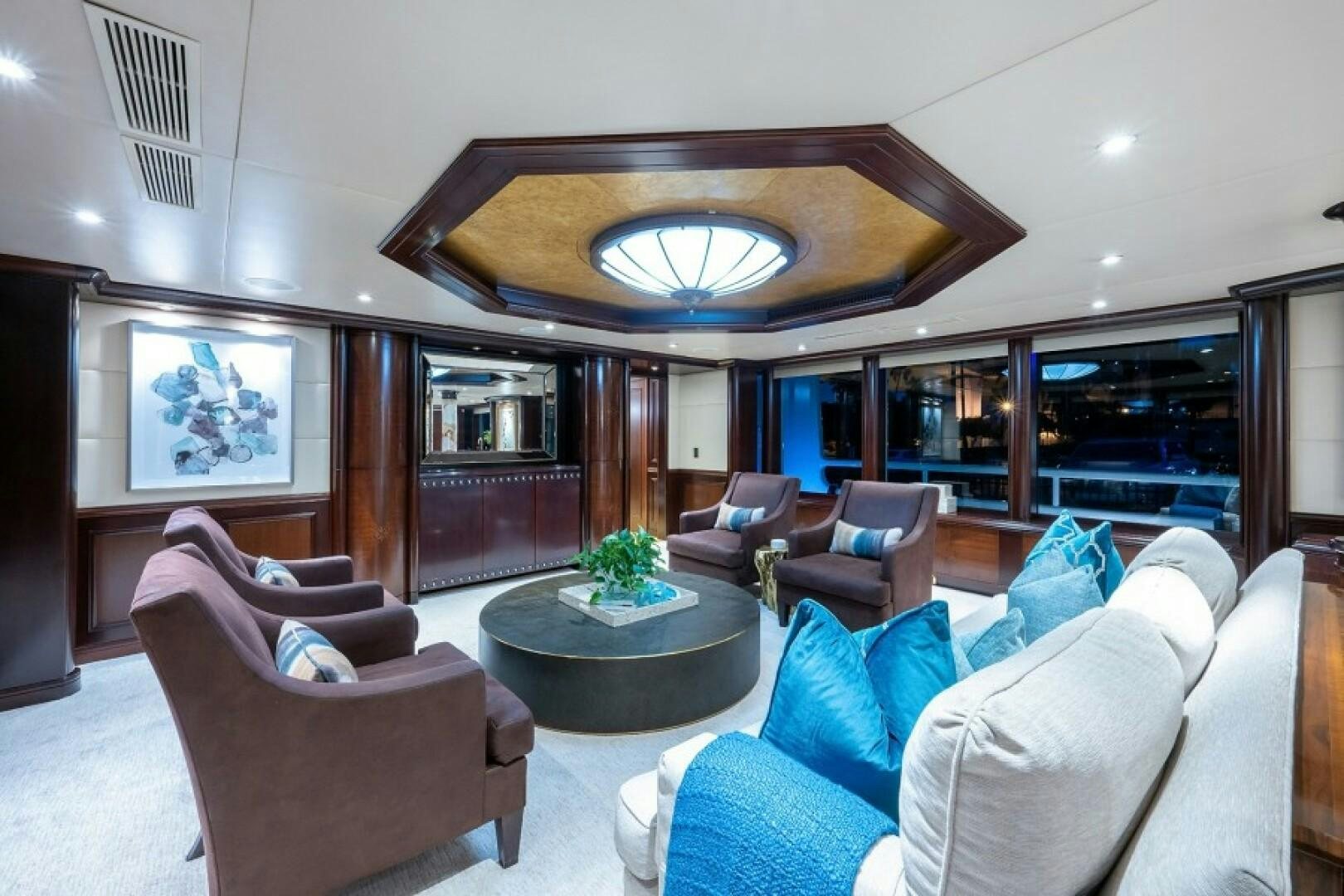 a living room with a large glass ceiling aboard STARSHIP Yacht for Sale