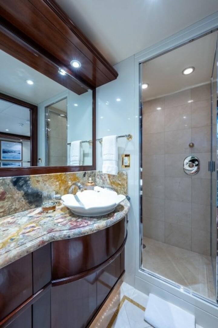 a bathroom with a marble countertop aboard STARSHIP Yacht for Sale