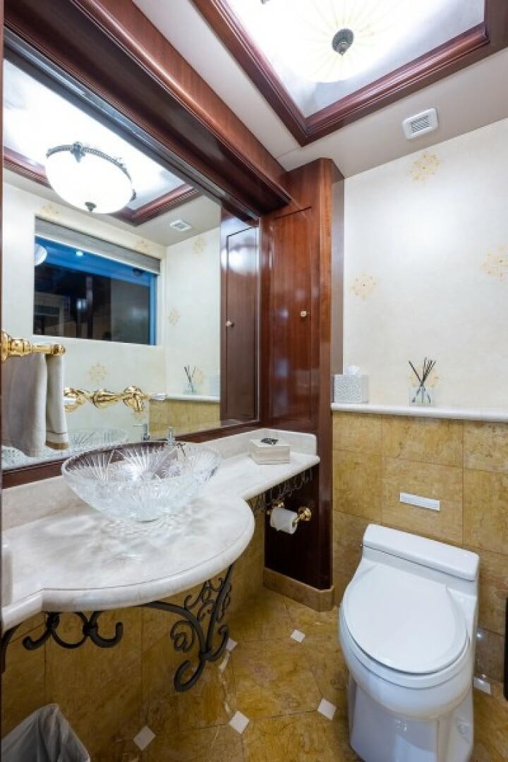 a bathroom with a sink toilet and a bathtub aboard STARSHIP Yacht for Sale