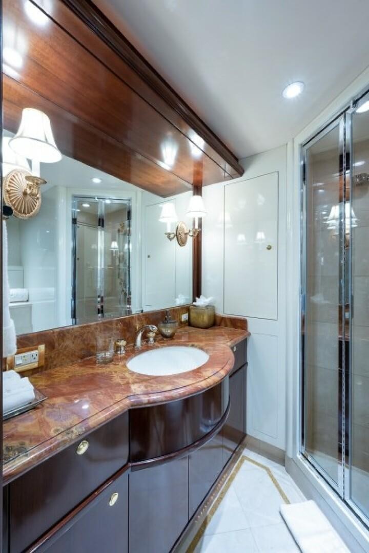 a bathroom with a sink and a mirror aboard STARSHIP Yacht for Sale