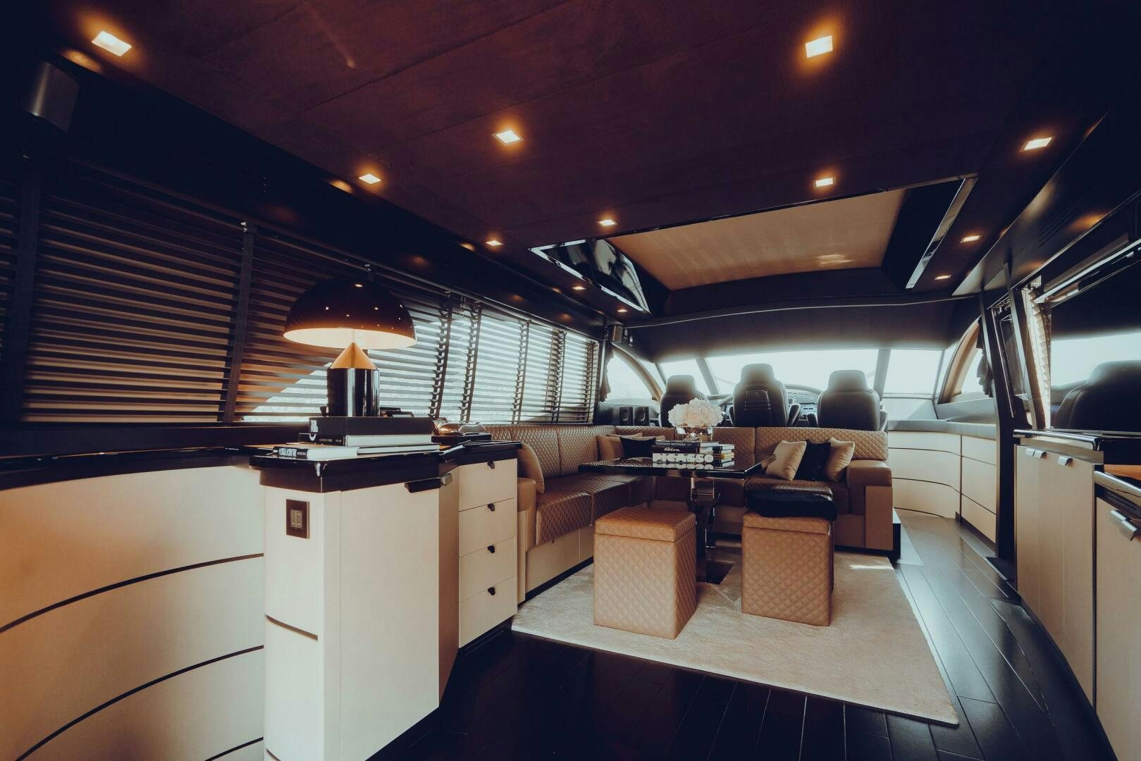 a room with a table and chairs aboard BLACK ROCK Yacht for Sale