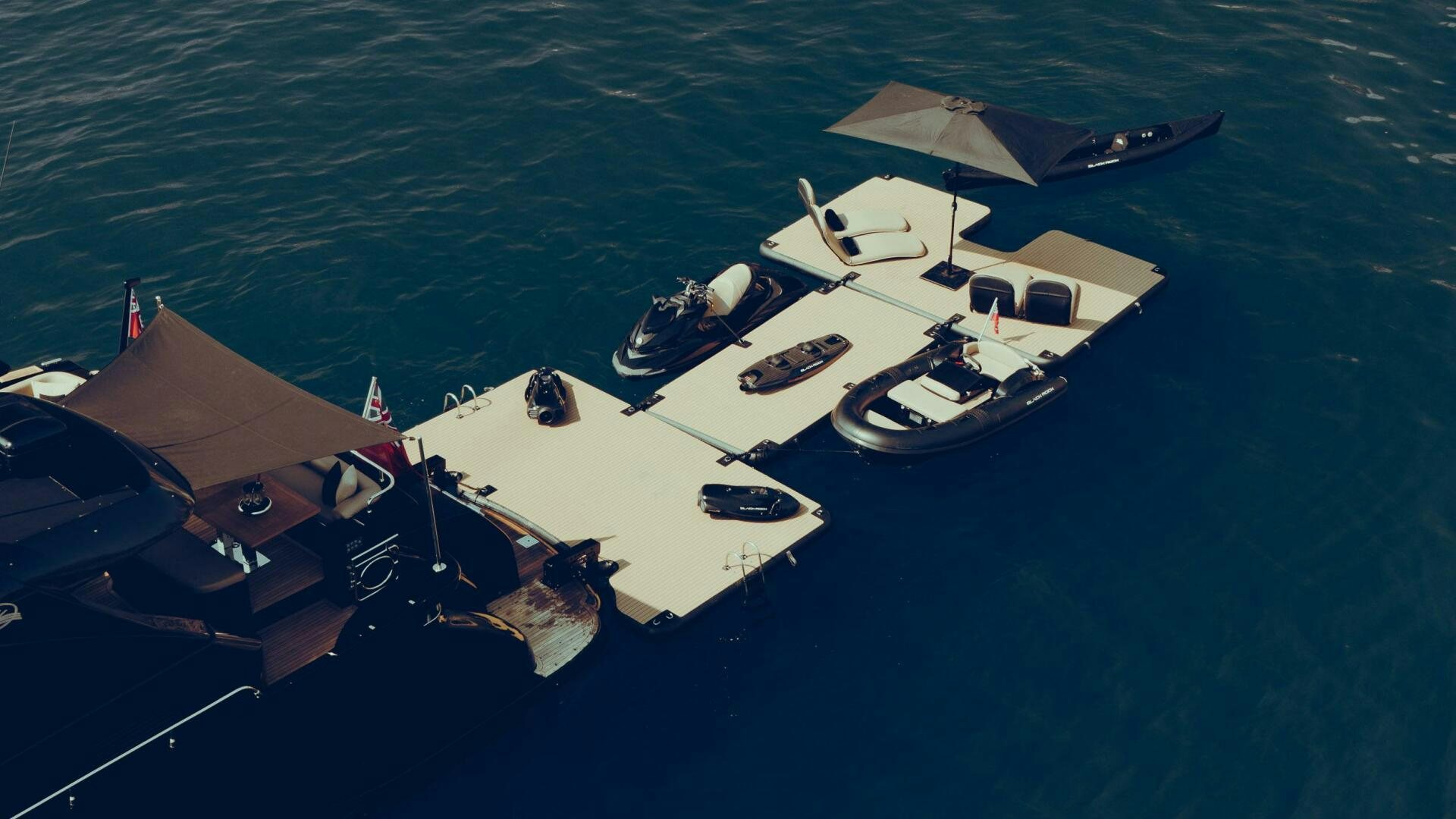a group of boats in the water aboard BLACK ROCK Yacht for Sale