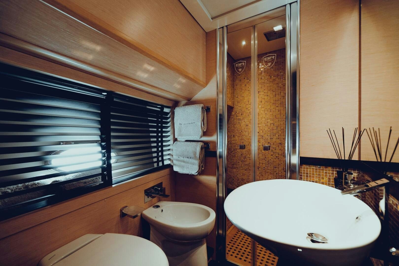 a bathroom with a sink and toilet aboard BLACK ROCK Yacht for Sale