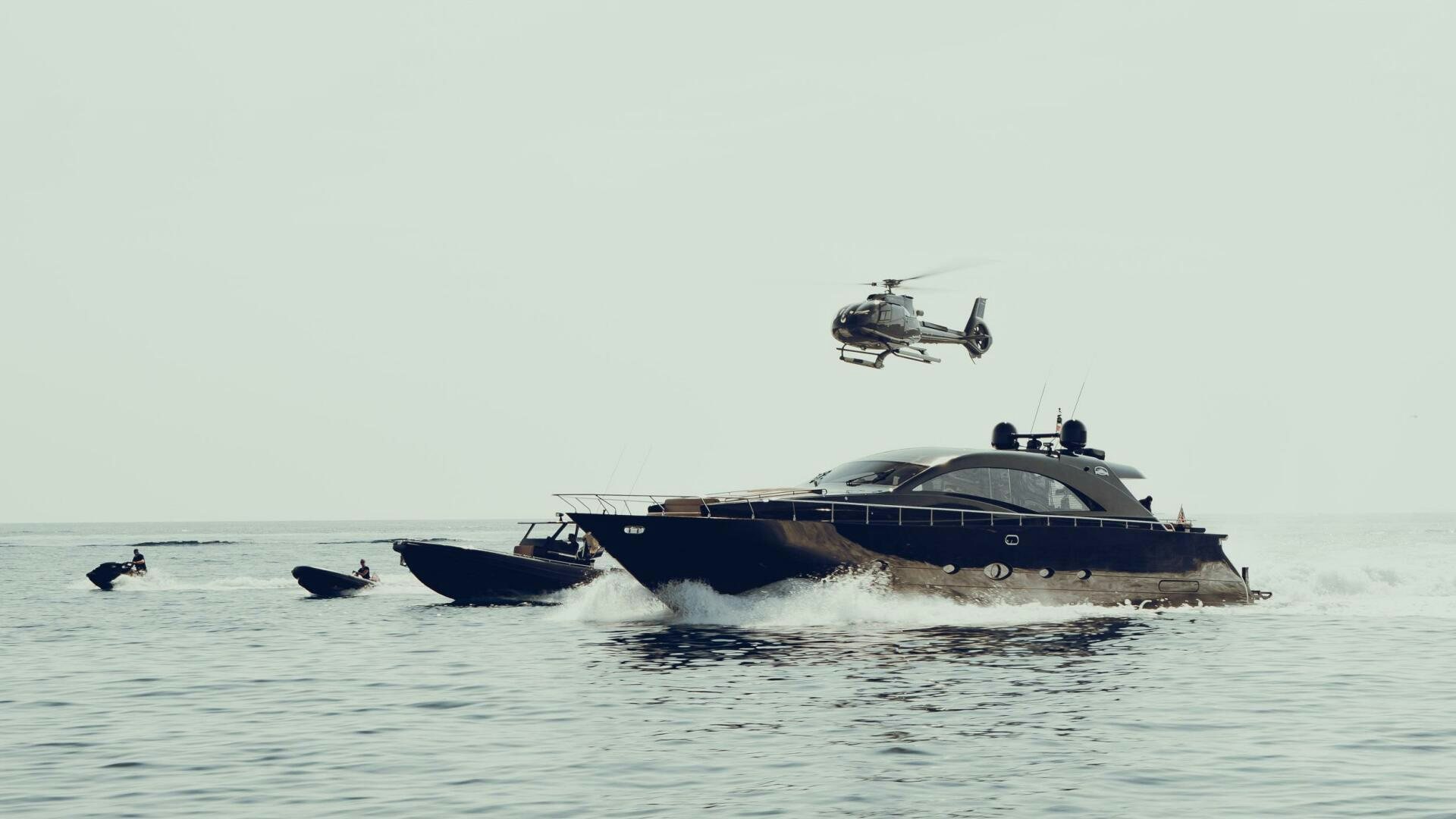 a helicopter flying over a boat aboard BLACK ROCK Yacht for Sale