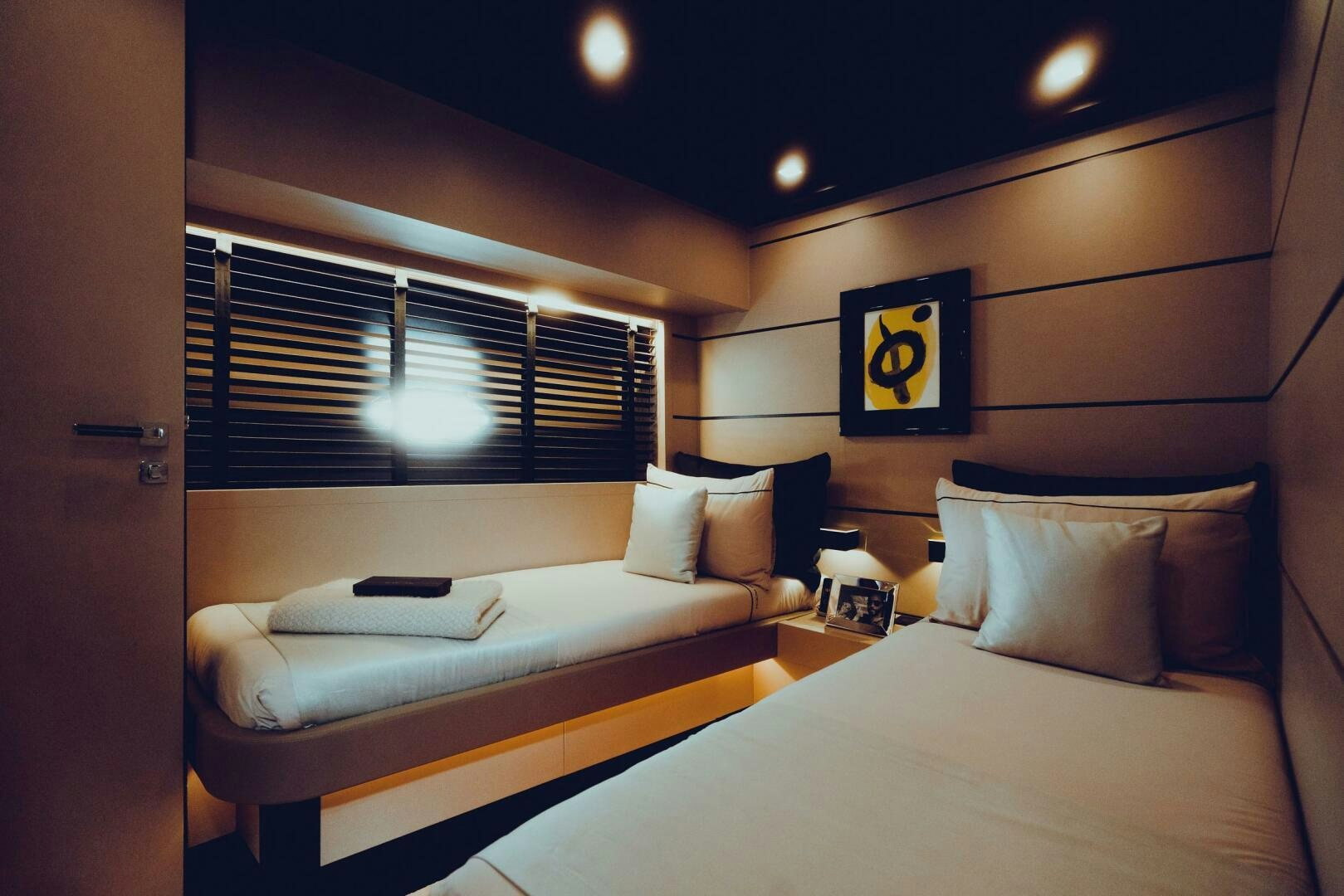 a room with two beds aboard BLACK ROCK Yacht for Sale