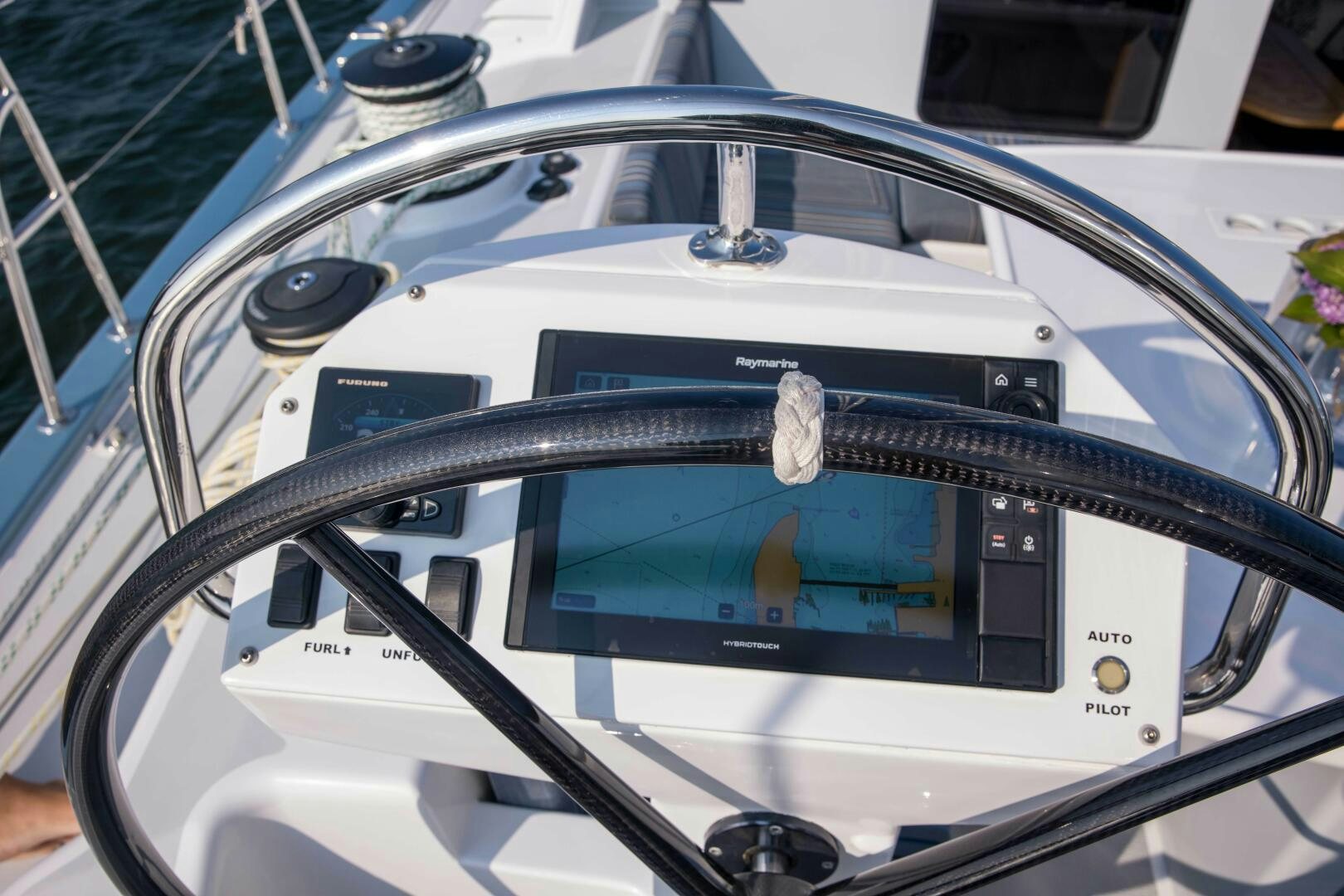 a steering wheel with a screen aboard LADY K Yacht for Sale