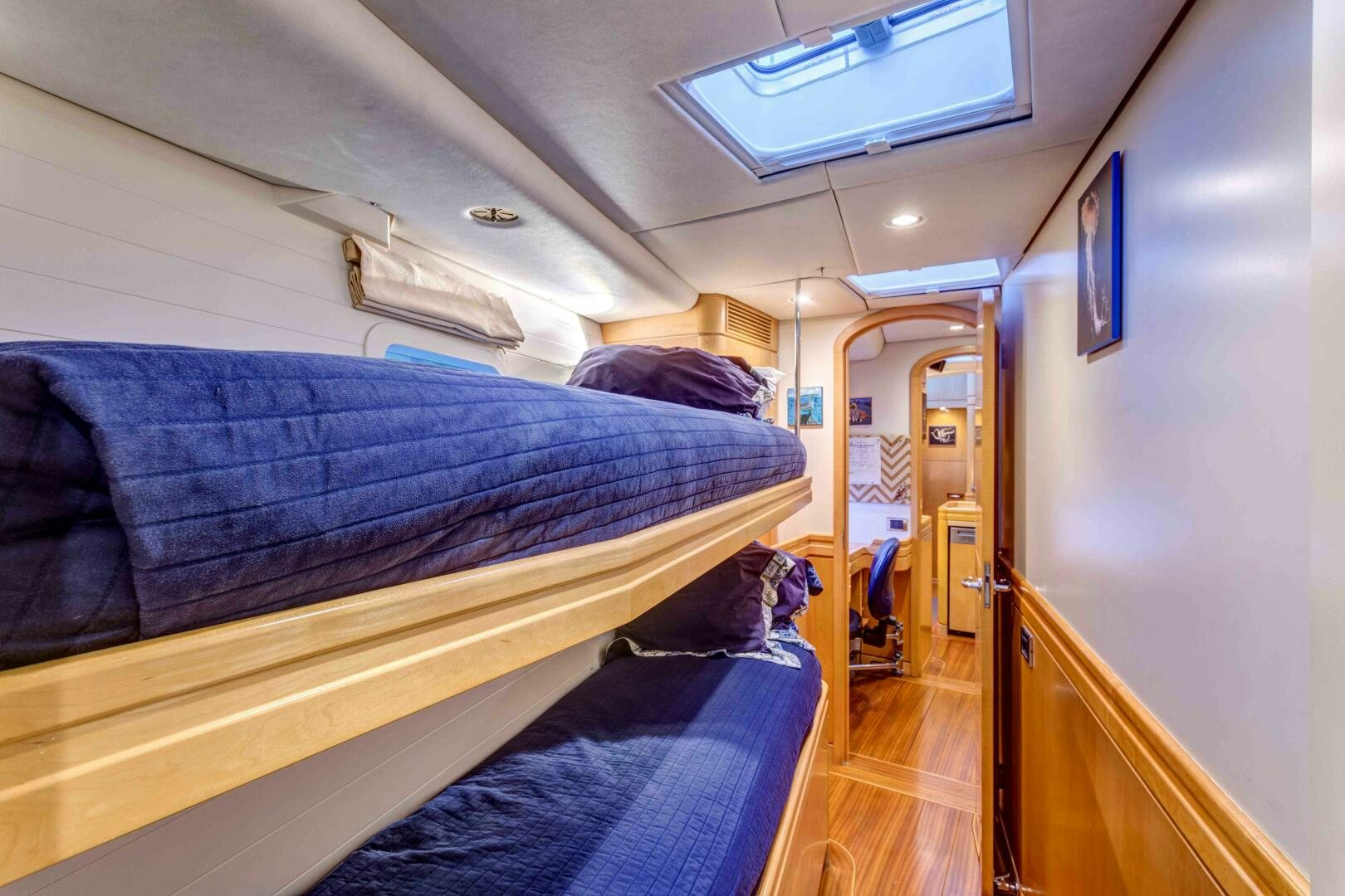 a person lying on a bed aboard LADY K Yacht for Sale