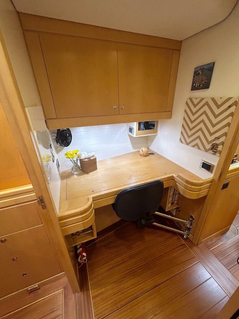a kitchen with a table and chairs aboard LADY K Yacht for Sale