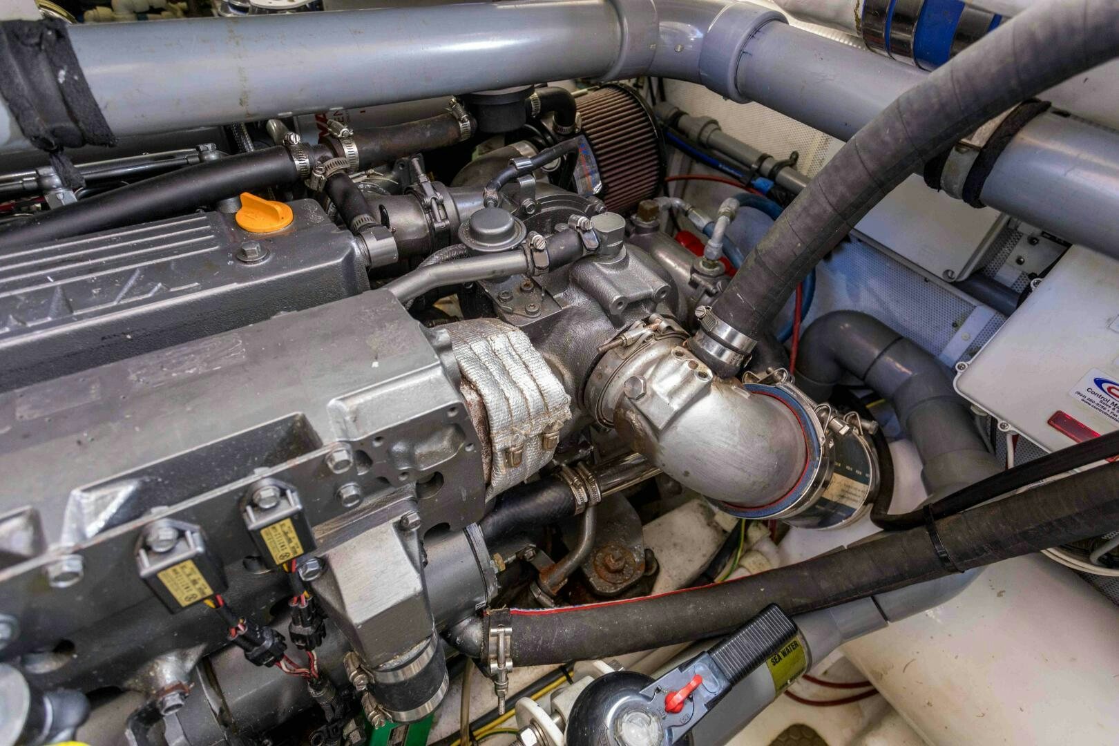 a car engine with a few pipes aboard LADY K Yacht for Sale