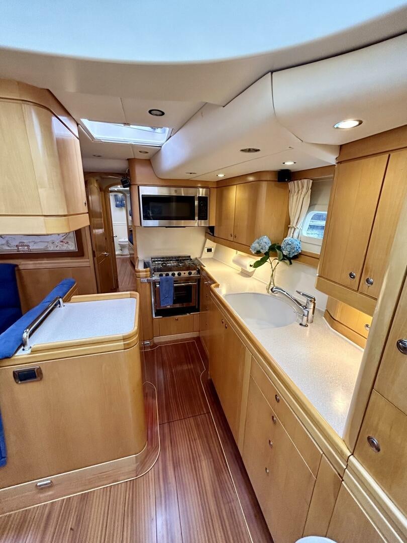 a kitchen with a large island aboard LADY K Yacht for Sale