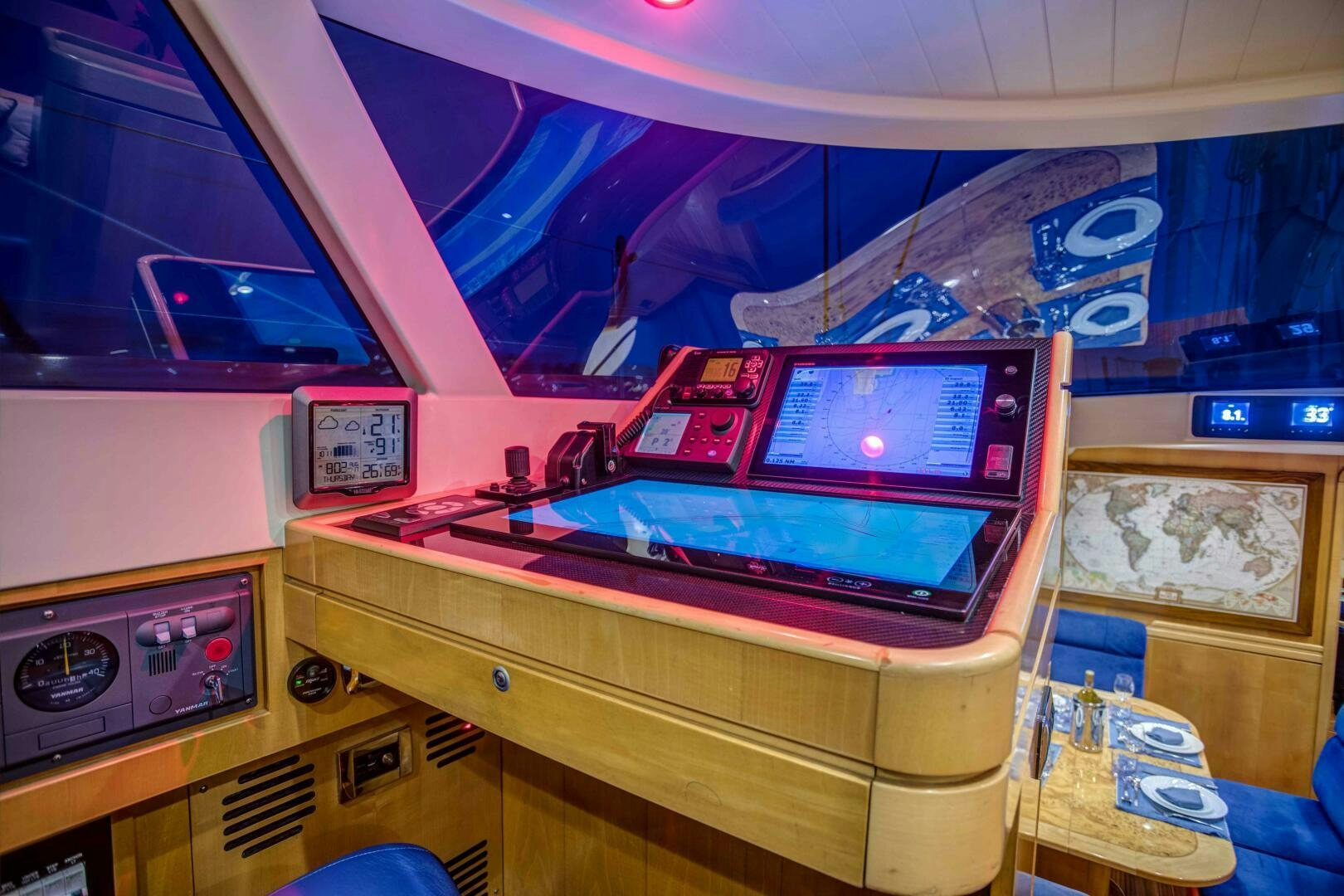 a computer desk with a monitor and a keyboard aboard LADY K Yacht for Sale