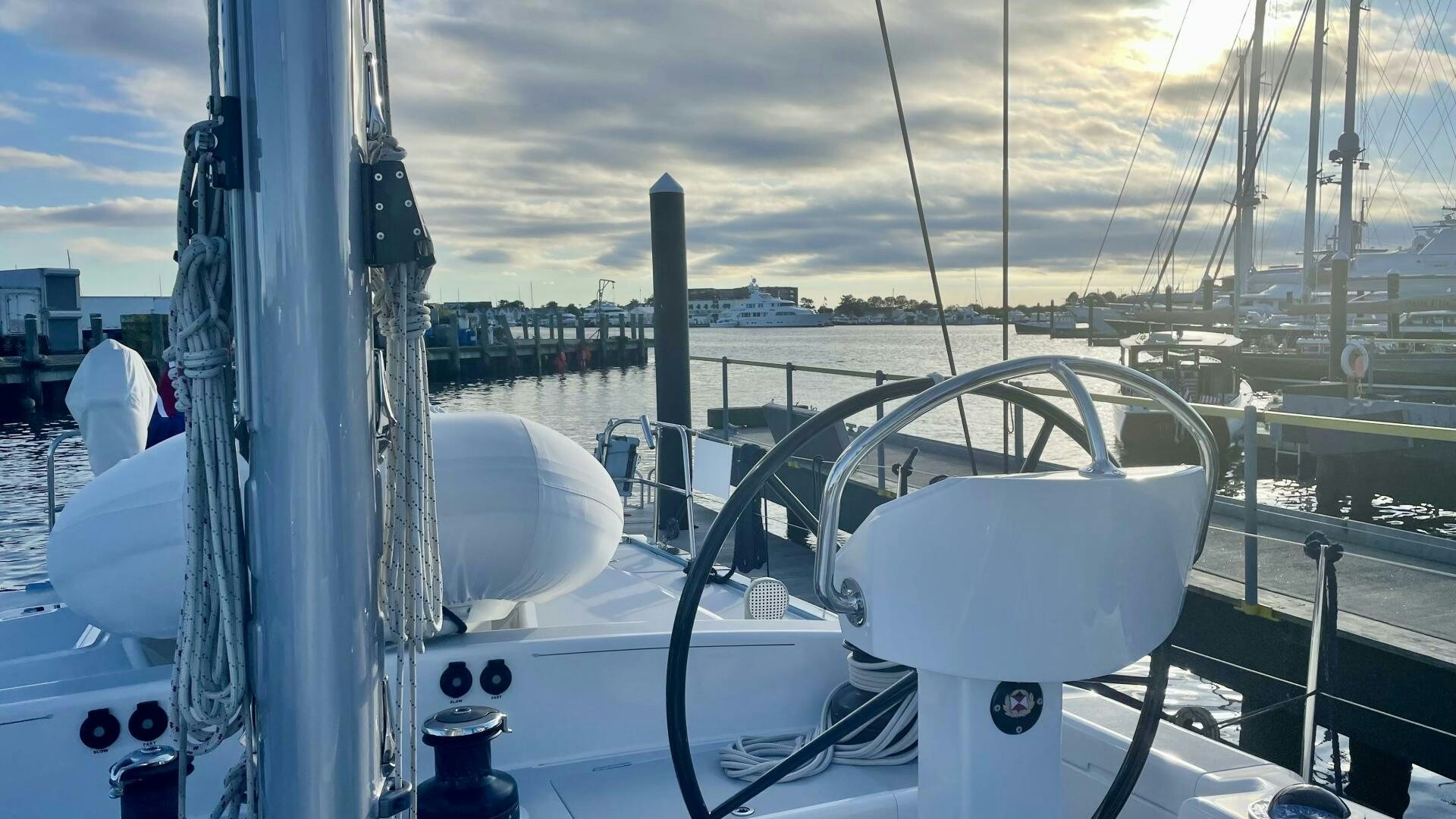 a white boat on a dock aboard LADY K Yacht for Sale