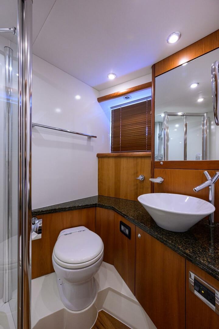 a bathroom with a sink and a toilet aboard THE SHI Yacht for Sale