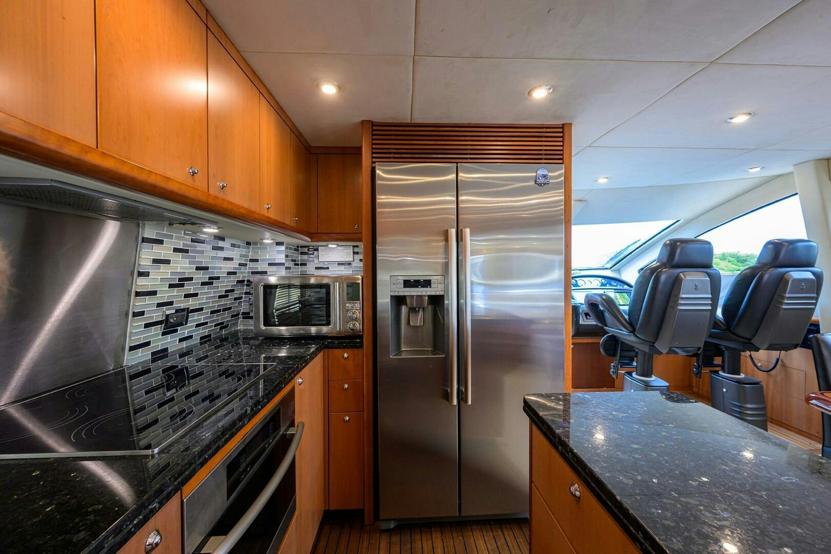a kitchen with stainless steel appliances aboard THE SHI Yacht for Sale