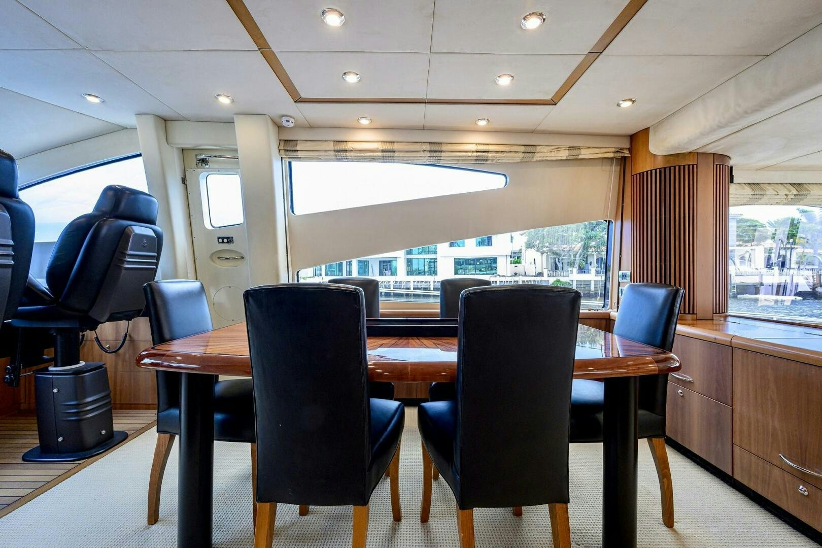 a large kitchen with a table and chairs aboard THE SHI Yacht for Sale