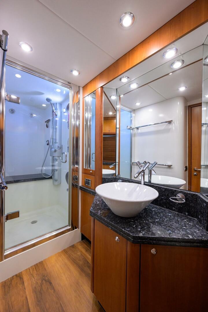a bathroom with a sink and a shower aboard THE SHI Yacht for Sale