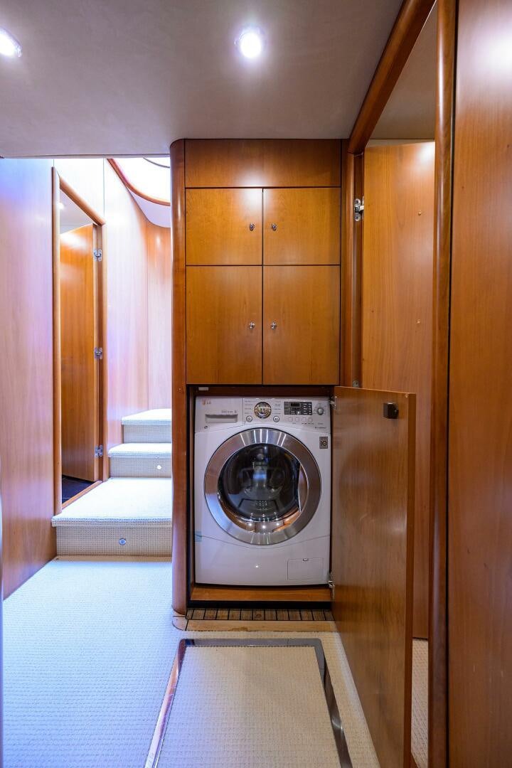 a washing machine in a room aboard THE SHI Yacht for Sale