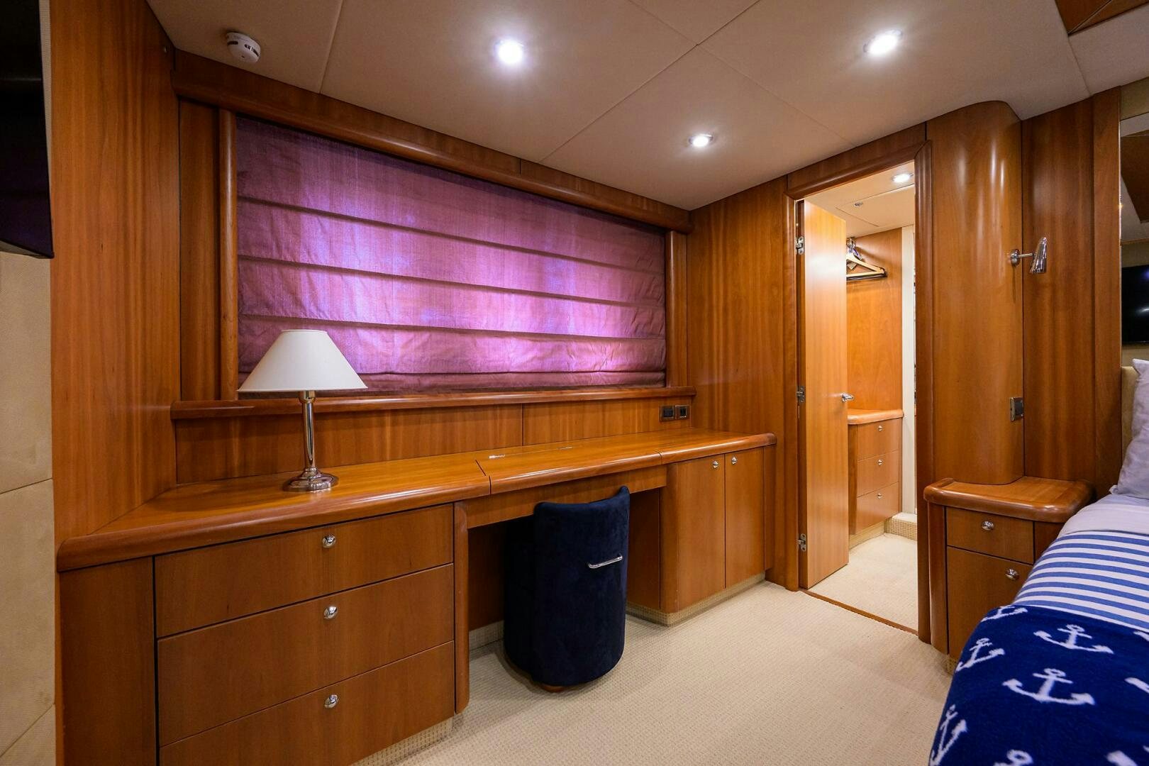 a room with a desk and a lamp aboard THE SHI Yacht for Sale