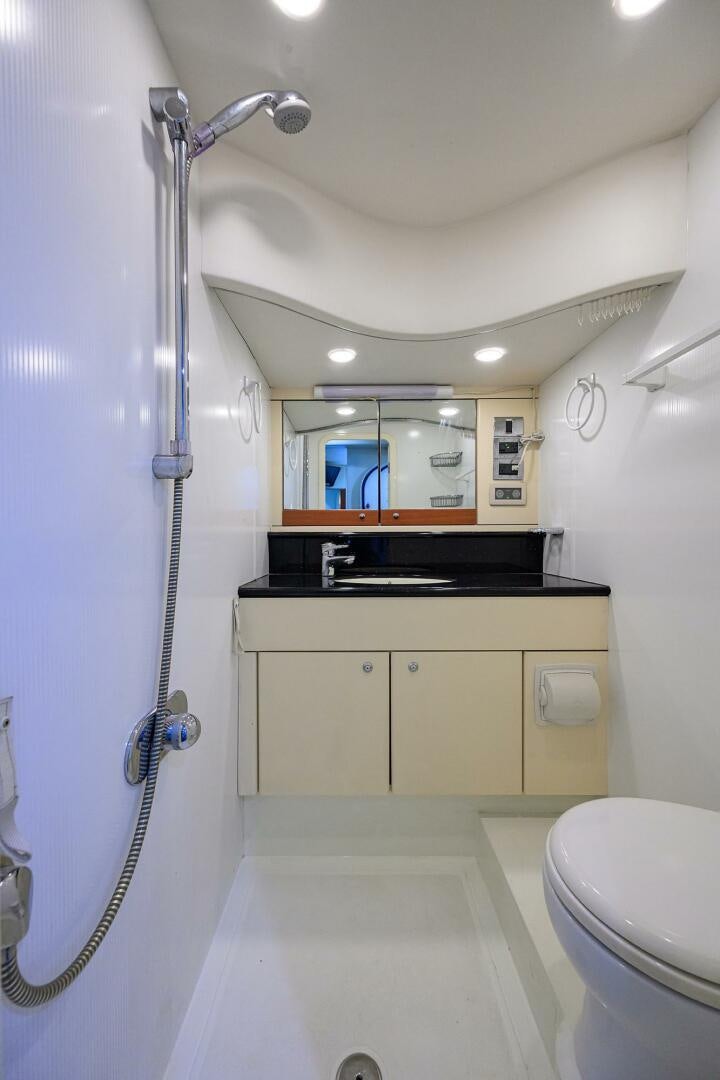 a bathroom with a sink and a toilet aboard THE SHI Yacht for Sale