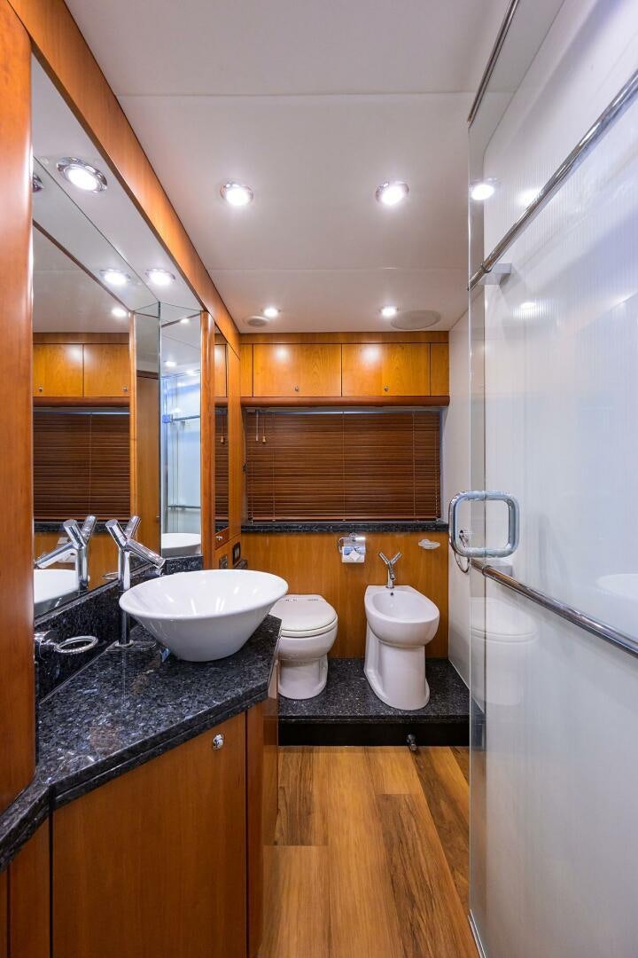 a bathroom with a sink toilet and a shower aboard THE SHI Yacht for Sale