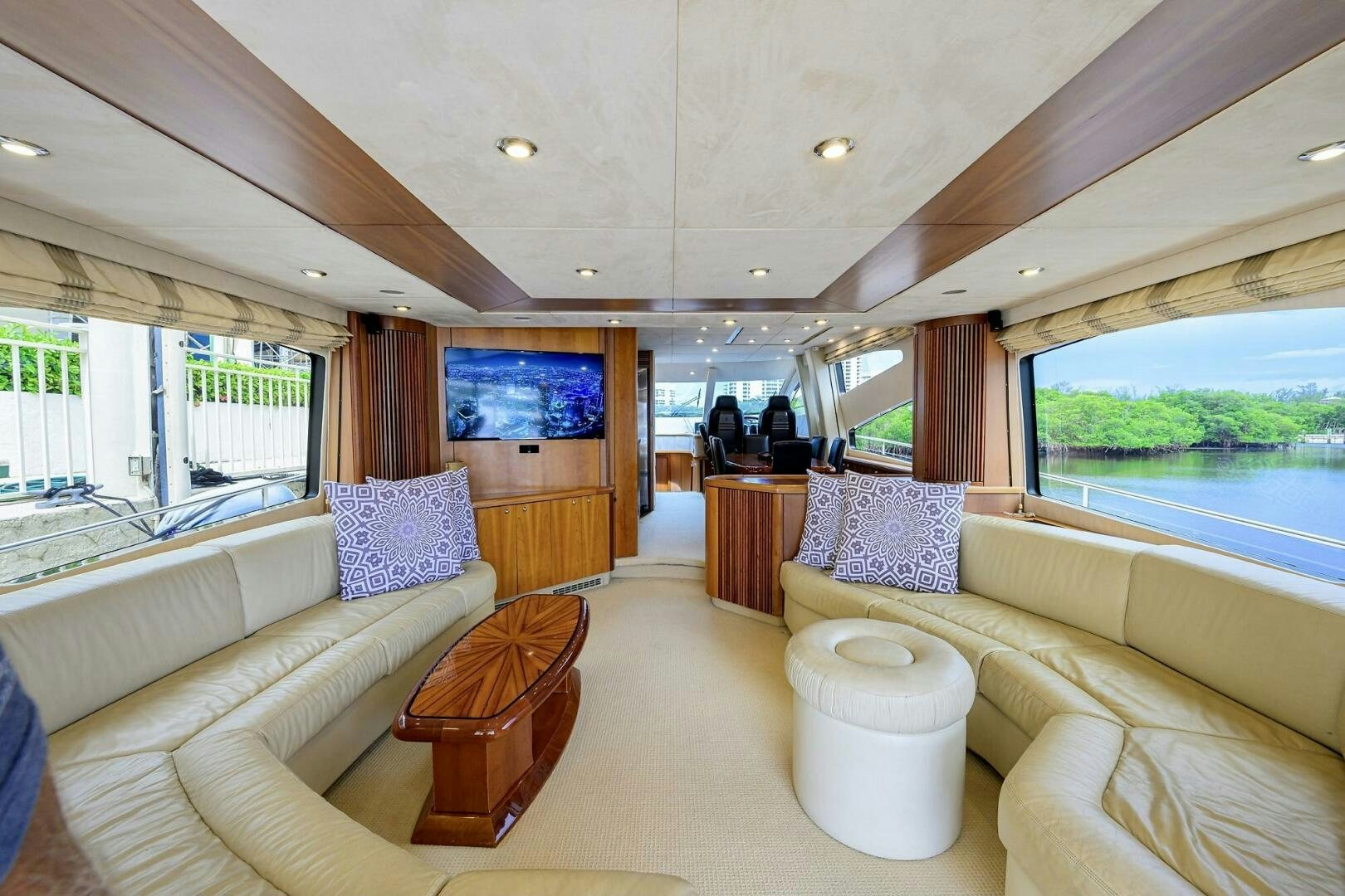 a large living room with a large window aboard THE SHI Yacht for Sale