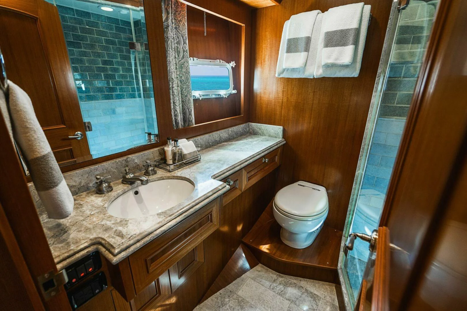 a bathroom with a sink and a toilet aboard MOONSHOT Yacht for Sale