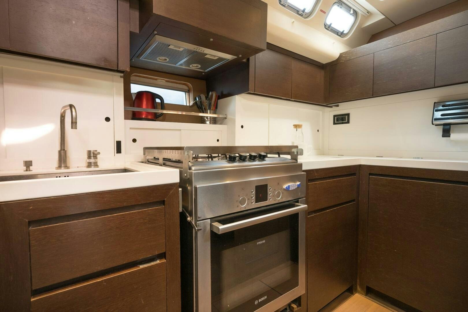 a kitchen with a stove and oven aboard HANNO Yacht for Sale