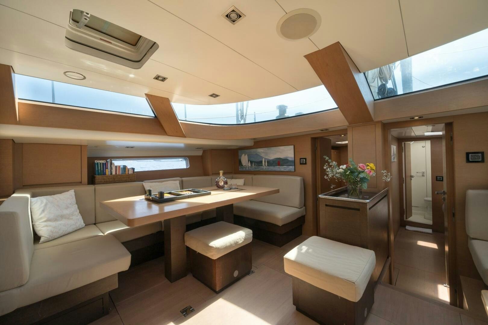 a room with a couch and a table aboard HANNO Yacht for Sale