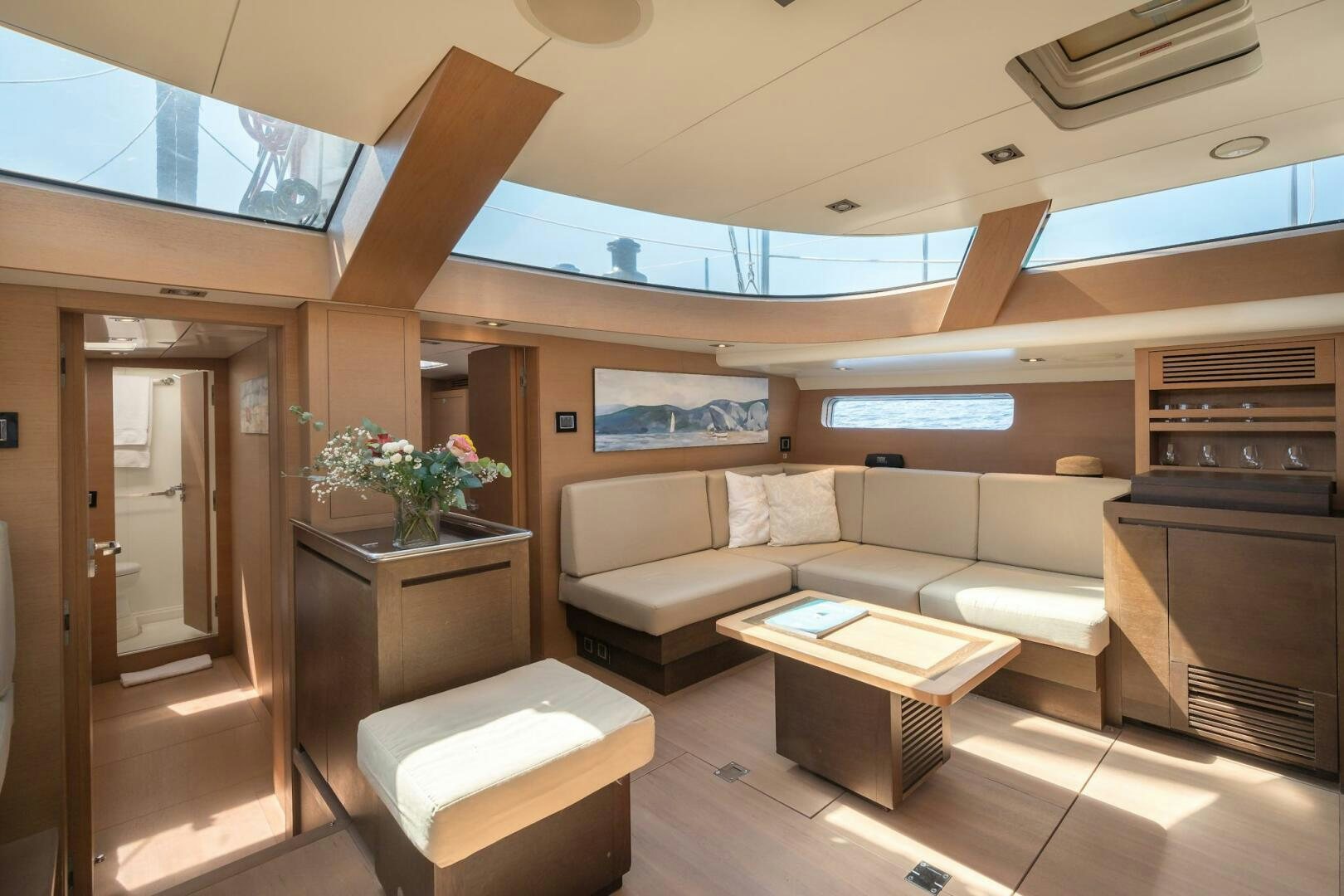 a living room with a couch and a coffee table aboard HANNO Yacht for Sale