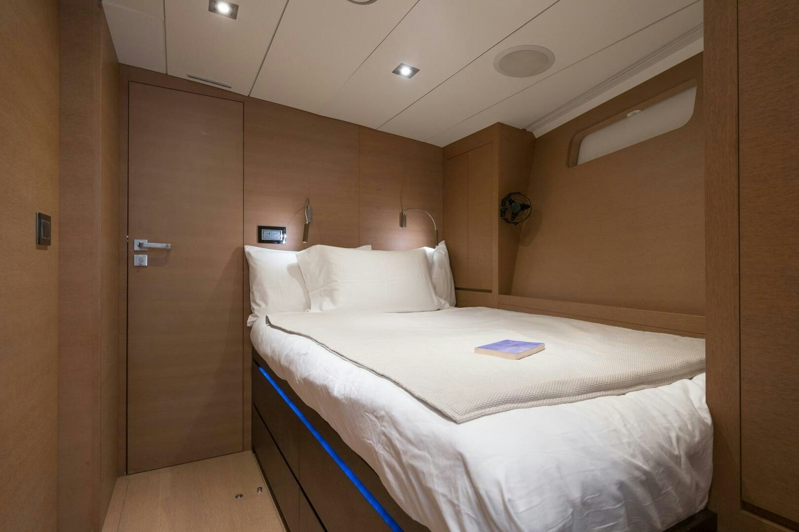 a room with a bed and a closet aboard HANNO Yacht for Sale