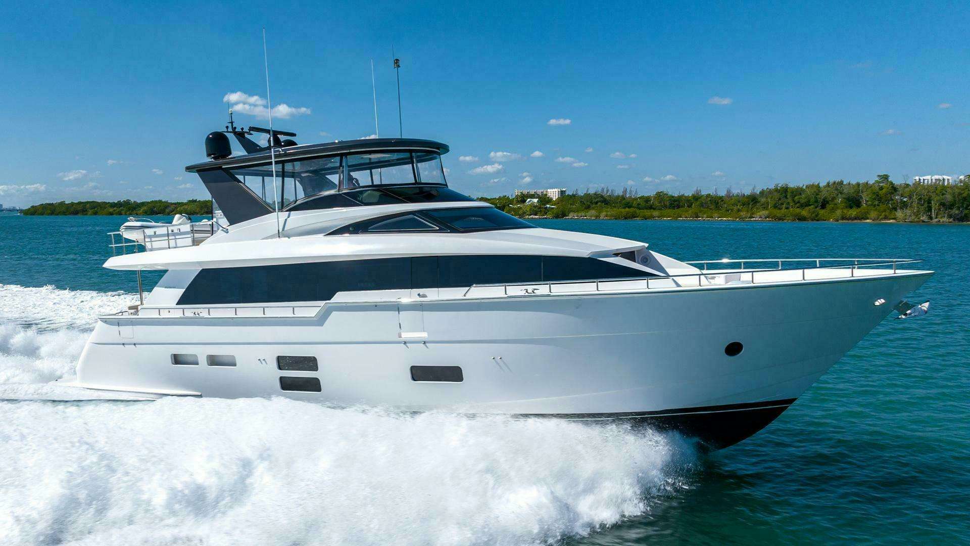 a white yacht on the water aboard EPIC Yacht for Sale