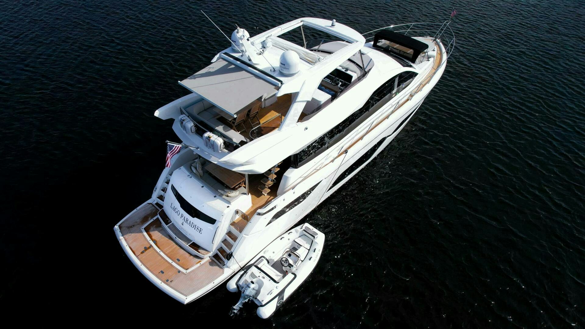 a white boat in the water aboard LAGO PARADISE Yacht for Sale