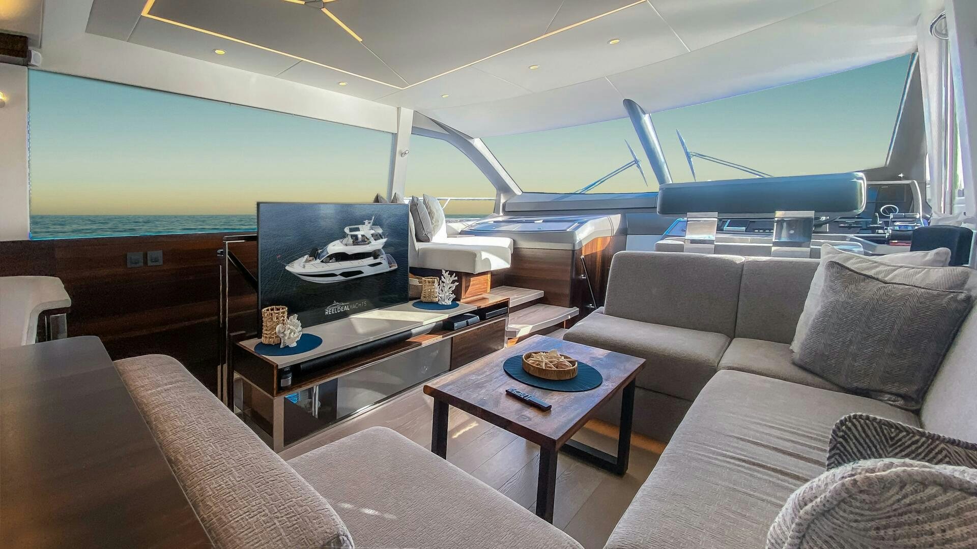 a room with a couch and a table aboard LAGO PARADISE Yacht for Sale