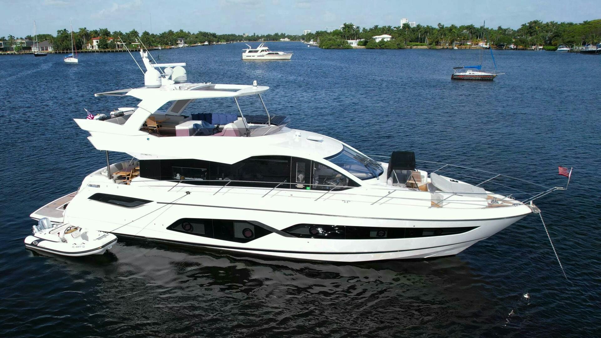 a white yacht on the water aboard LAGO PARADISE Yacht for Sale
