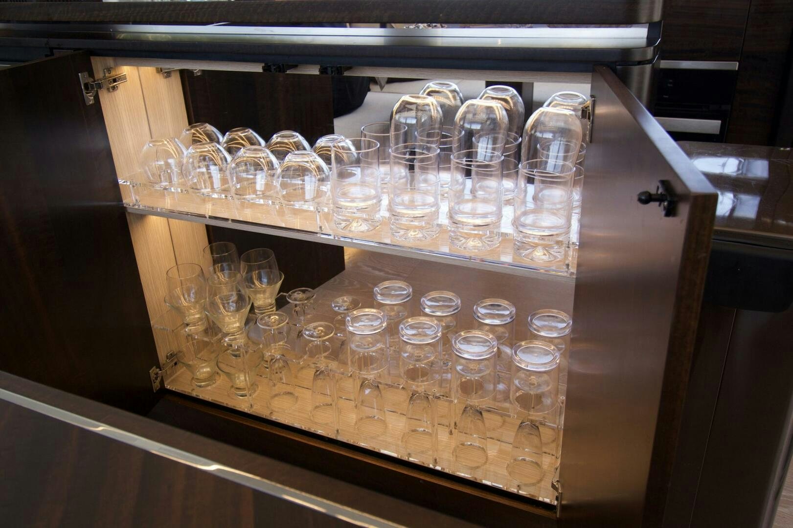 a glass case with many plastic containers of ice cream aboard LAGO PARADISE Yacht for Sale