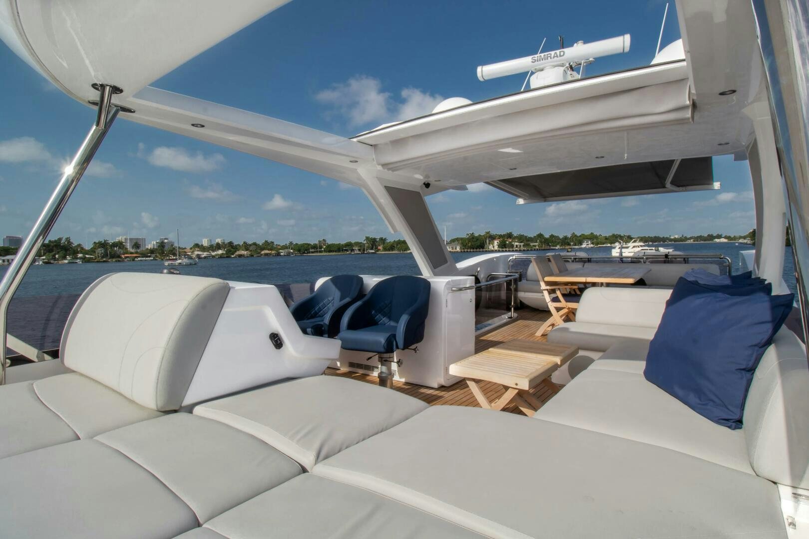 a large white boat with a white lounge chair and a white lounge chair aboard LAGO PARADISE Yacht for Sale