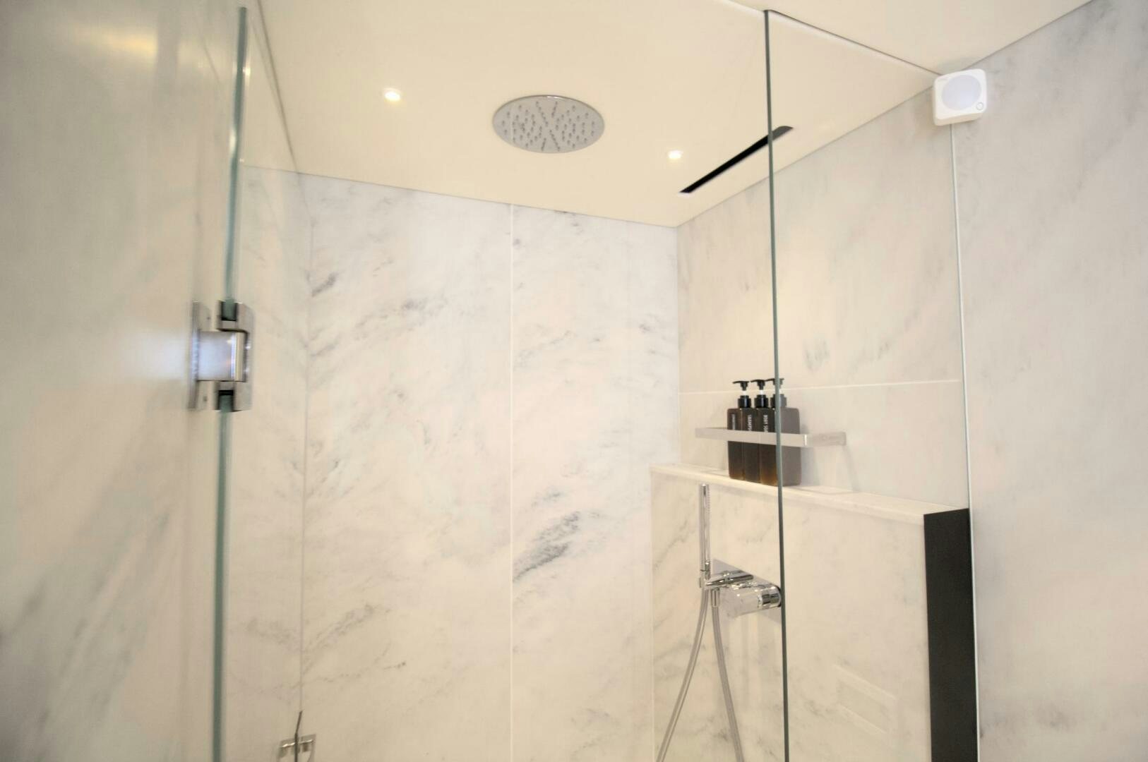 a shower with a shower curtain aboard LAGO PARADISE Yacht for Sale