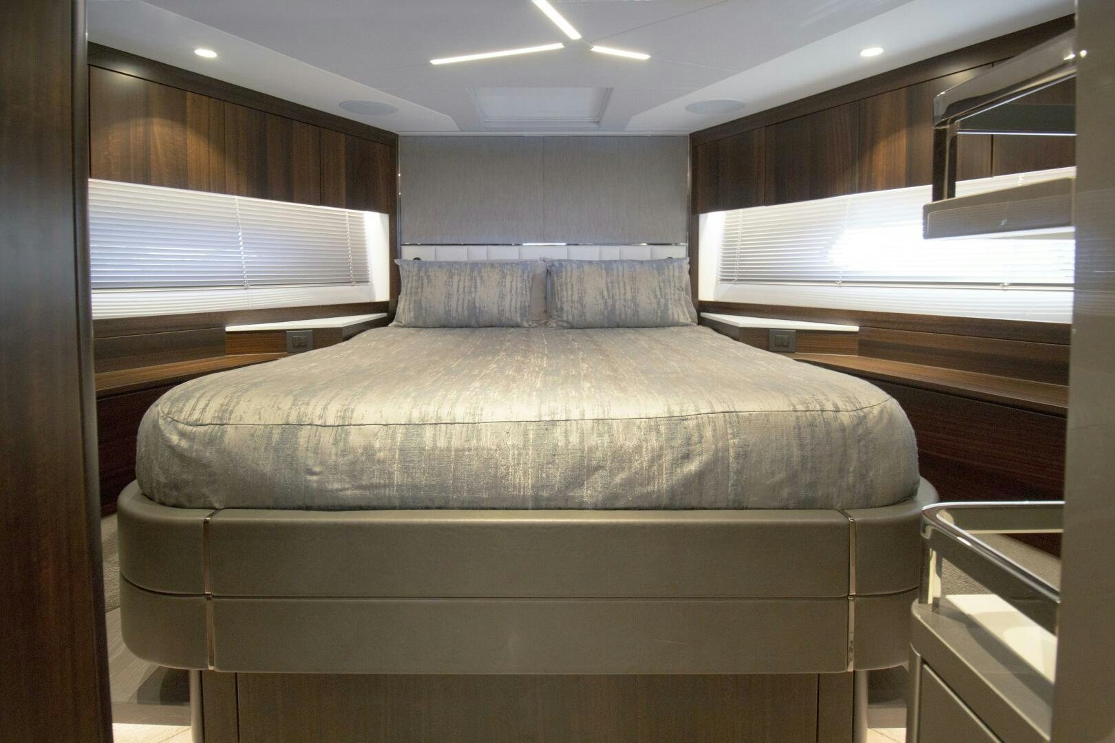 a bed in a room aboard LAGO PARADISE Yacht for Sale
