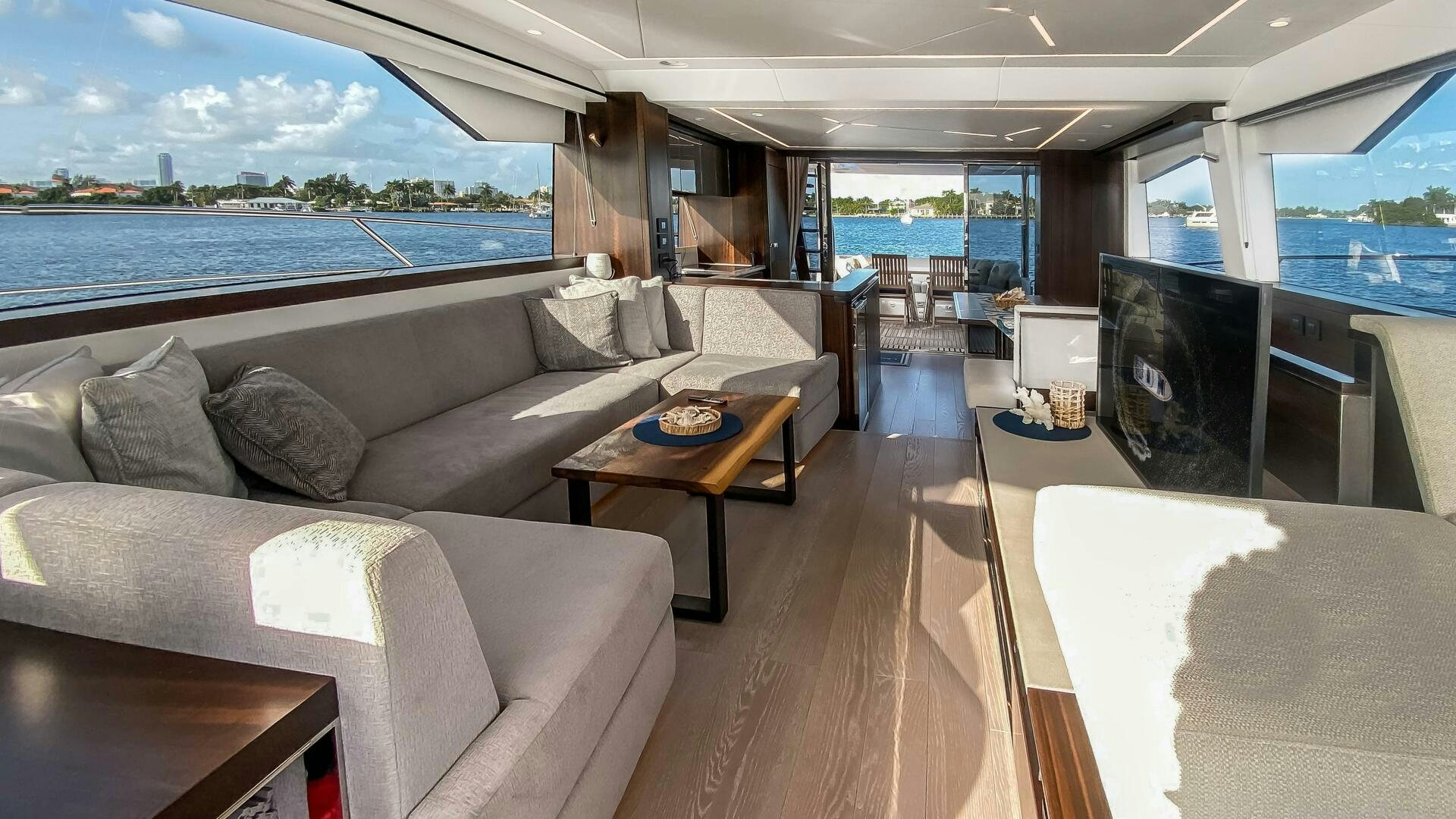 a living room with a large window aboard LAGO PARADISE Yacht for Sale