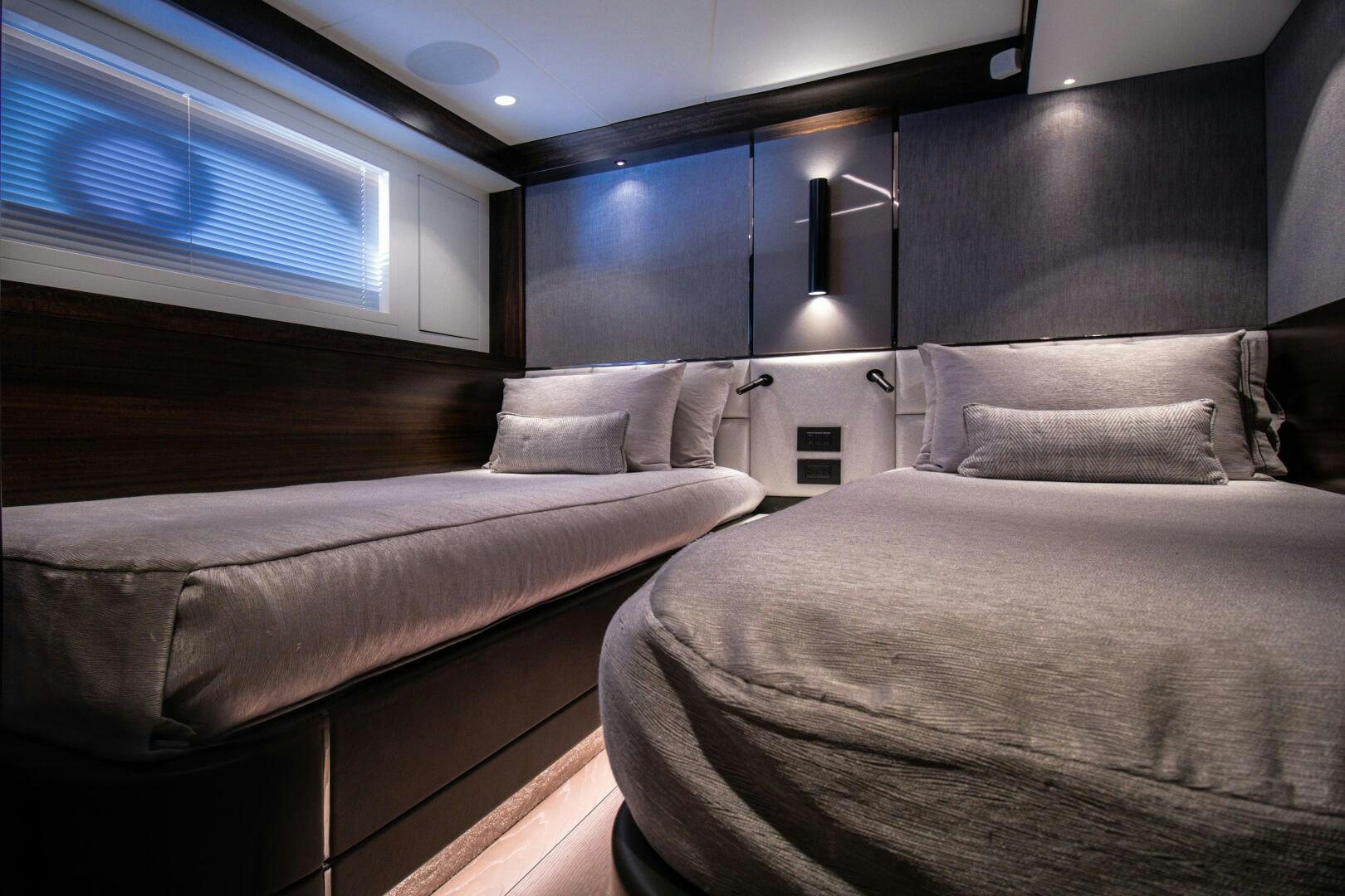 a room with two beds aboard LAGO PARADISE Yacht for Sale