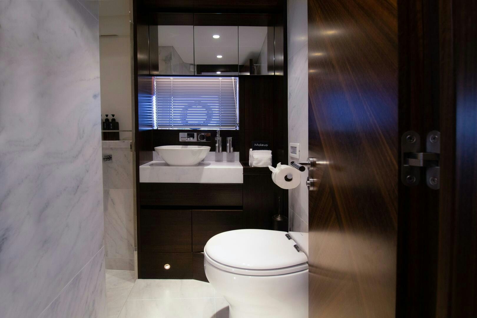 a bathroom with a sink and toilet aboard LAGO PARADISE Yacht for Sale