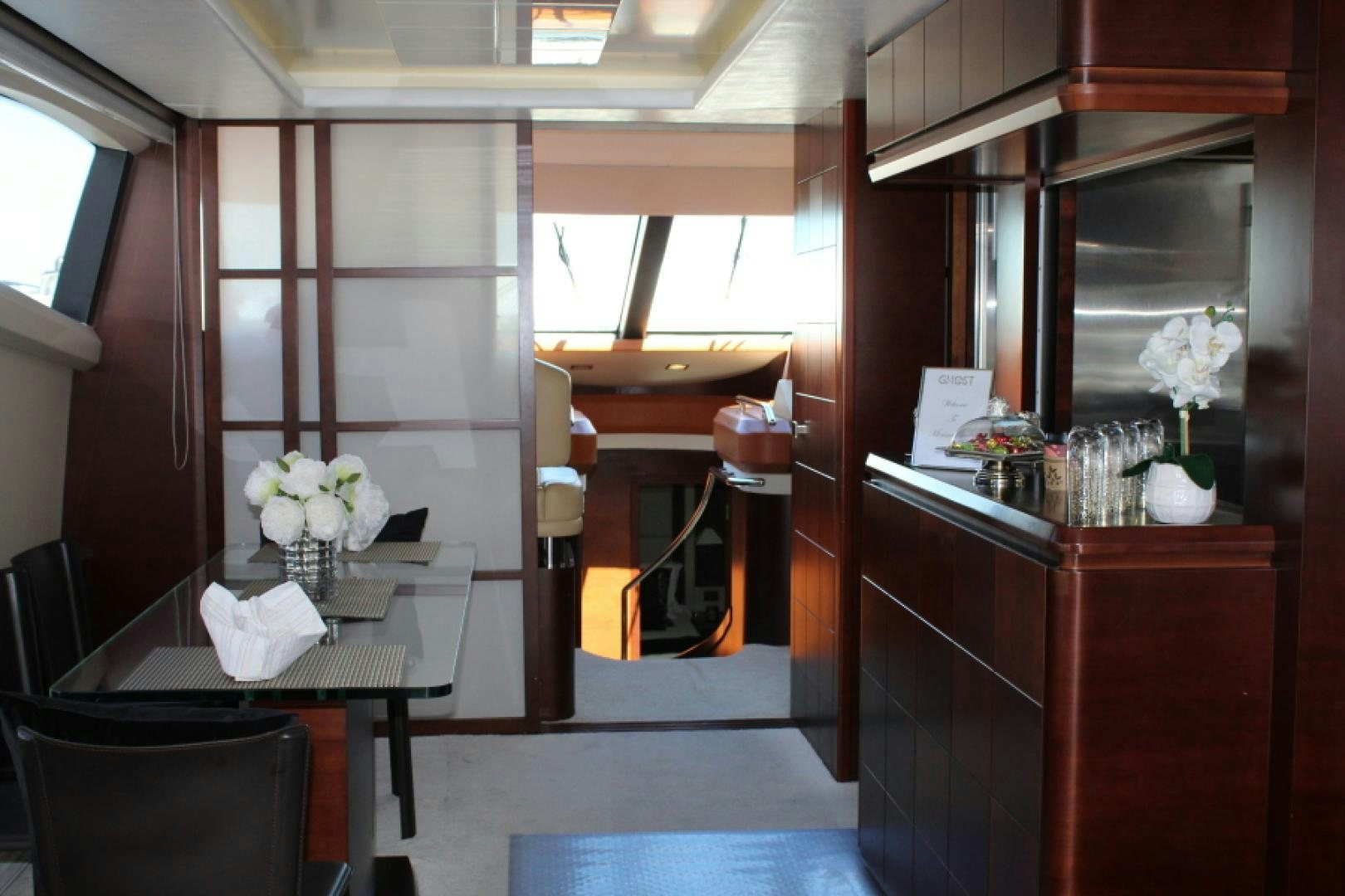 a room with a table and chairs aboard MINIMAL RISK Yacht for Sale