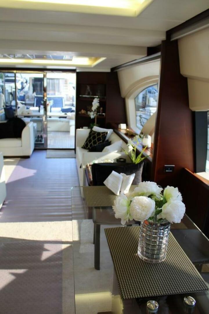 a vase of flowers on a table aboard MINIMAL RISK Yacht for Sale