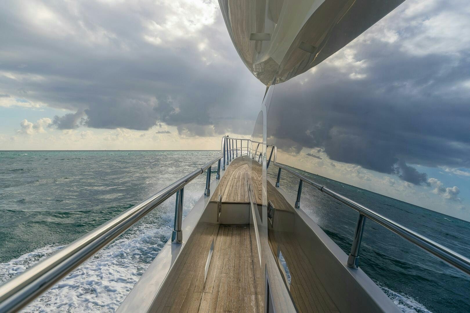 a wooden dock over water aboard MINIMAL RISK Yacht for Sale