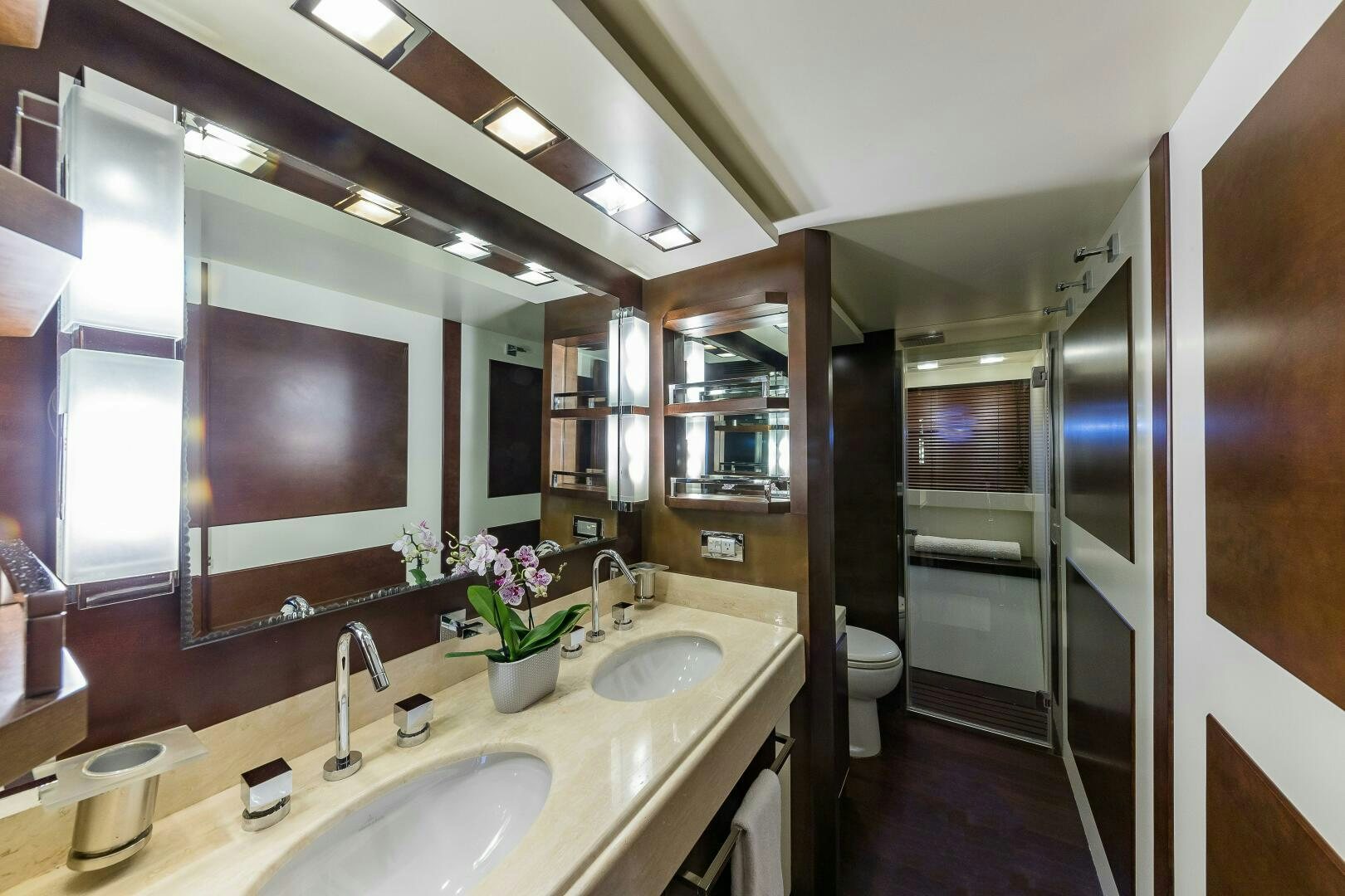 a bathroom with a sink and a mirror aboard MINIMAL RISK Yacht for Sale