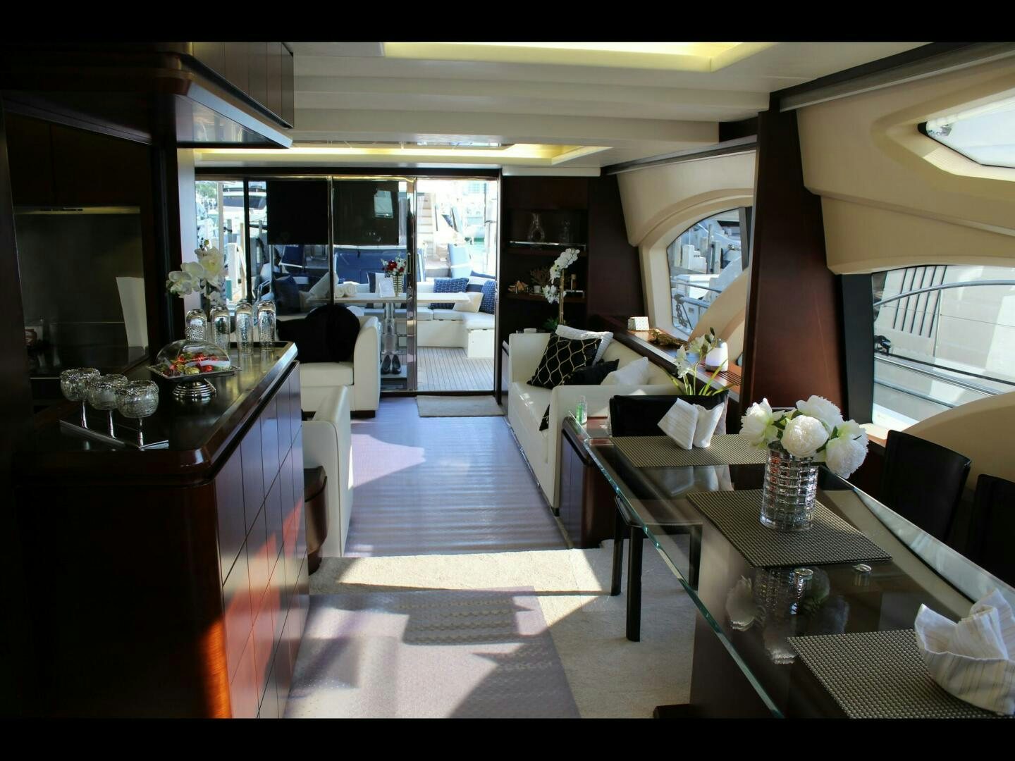 a room with a table and chairs aboard MINIMAL RISK Yacht for Sale