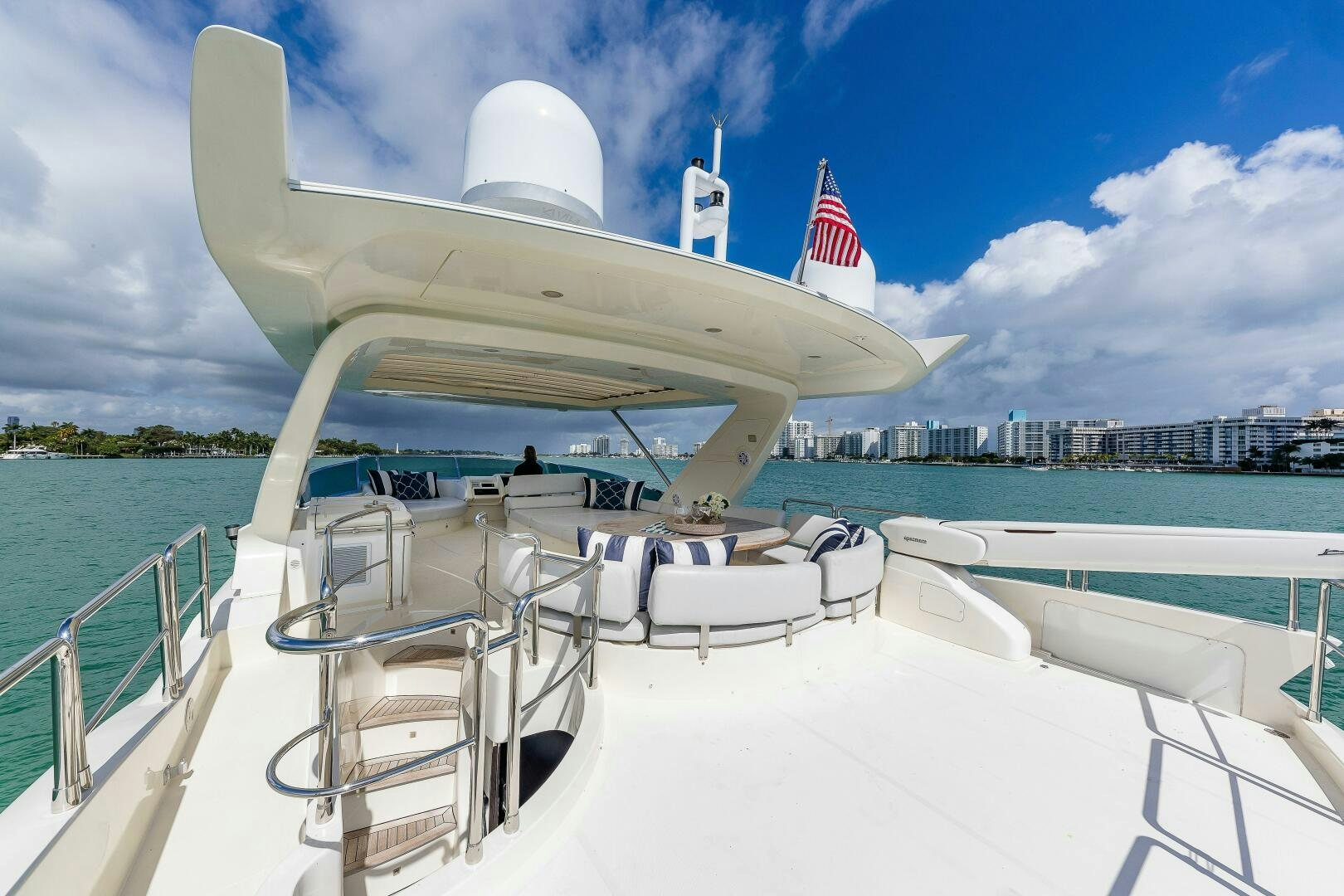 a large white boat on a body of water aboard MINIMAL RISK Yacht for Sale