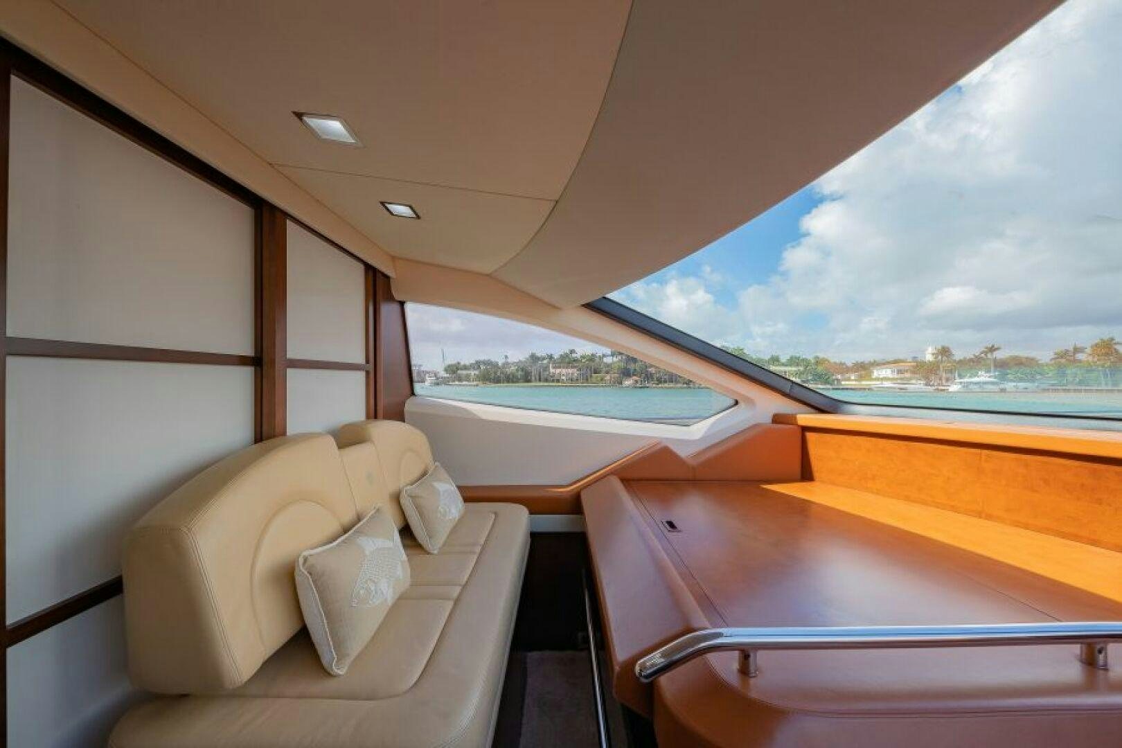 a room with a bed and a large window aboard MINIMAL RISK Yacht for Sale